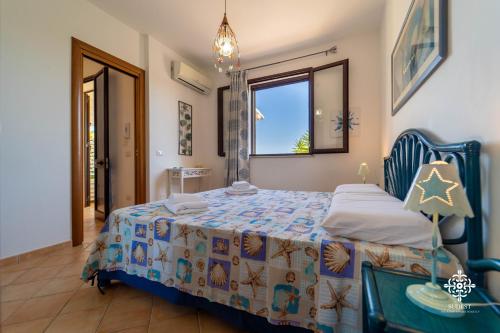 Katil atau katil-katil dalam bilik di Borgo Marino Beach Residence