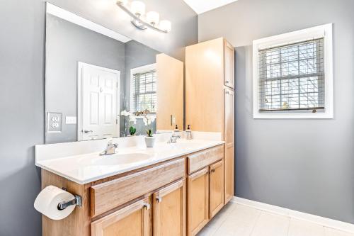 a bathroom with a sink and a mirror at Oyster Bay Villas --- 20411 Jeb Dr Unit #37 in Rehoboth Beach