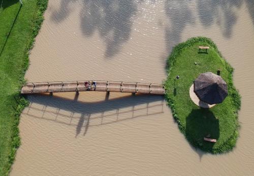 an aerial view of a bridge over a river at Sitio Castelinho in Cesário Lange