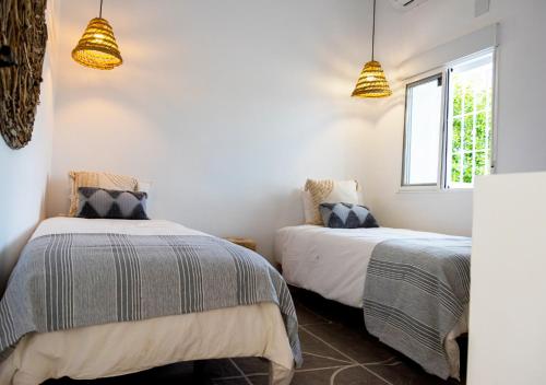 A bed or beds in a room at Exclusivo cortijo con piscina privada