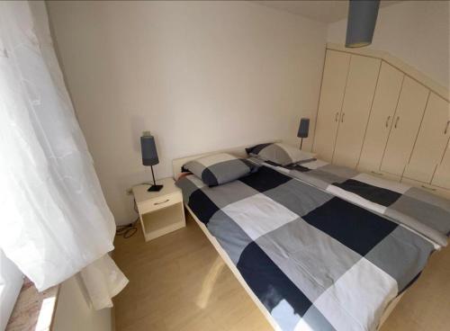 Ένα ή περισσότερα κρεβάτια σε δωμάτιο στο Ferienhaus Dalmatia