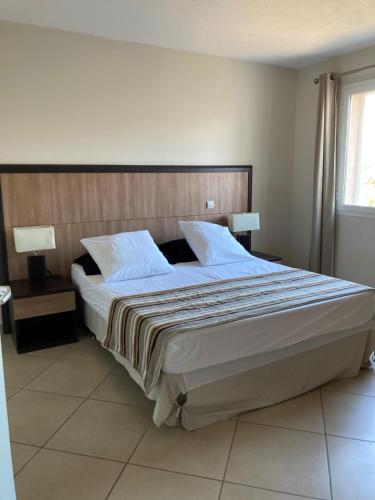 Posteľ alebo postele v izbe v ubytovaní Résidence Luxe à Porto Vecchio