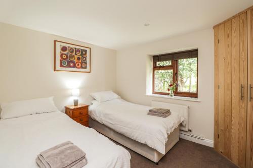 מיטה או מיטות בחדר ב-Loose Farm Lodge
