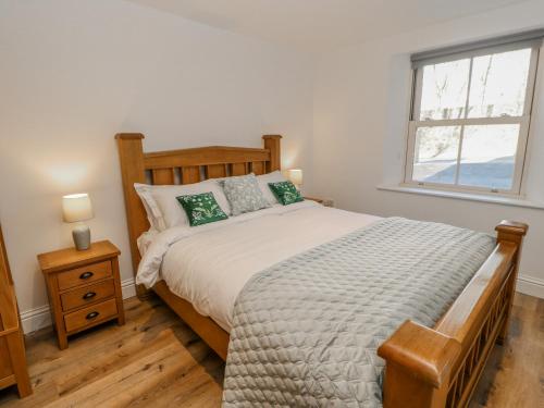Llit o llits en una habitació de Bramblewood Cottage