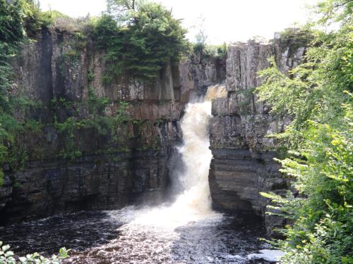 a waterfall on the side of a river at Bramblewood Cottage in Middleton in Teesdale