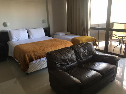 Cama o camas de una habitación en Apart Hotel 123 no Coração de Brasilia Kubitschek Plaza