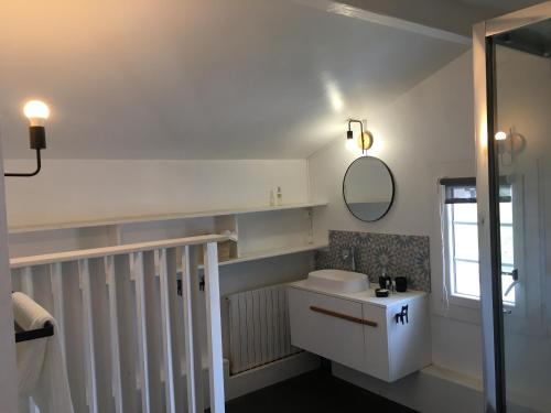 a bathroom with a sink and a mirror at Haritza in Anglet