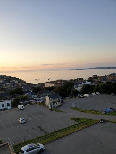 a parking lot with cars parked in a parking lot at Newquay Horizons in Newquay