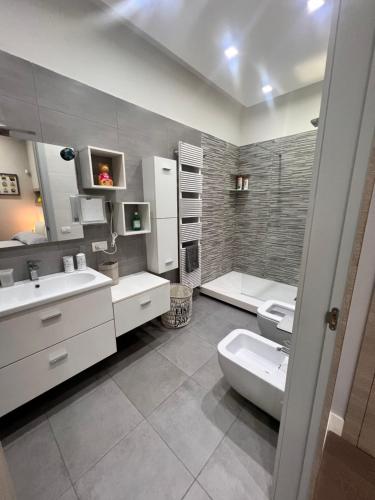 a bathroom with a sink and a toilet in it at RaRoom Boutique in Torre del Greco