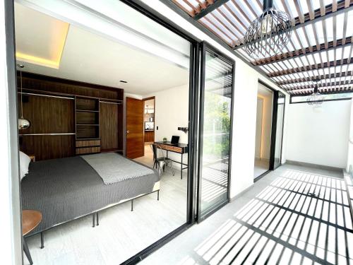 a bedroom with a bed and a desk at Condesa Lives in Mexico City