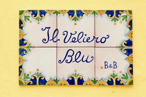 a tile wall with a sign that reads la villa bliva blue at Il Veliero Blu Lipari Centro - Guest House in Lipari