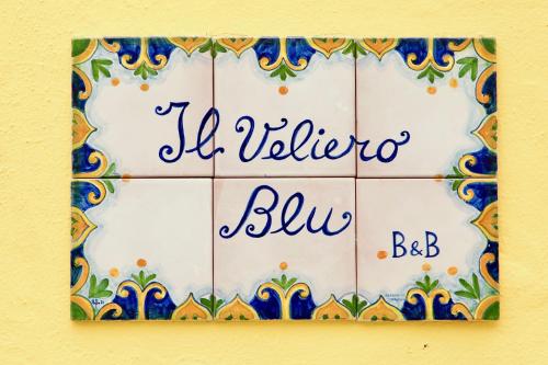 a tile wall with a sign that reads la villa bliva blue at Il Veliero Blu B&B Lipari Centro in Lipari