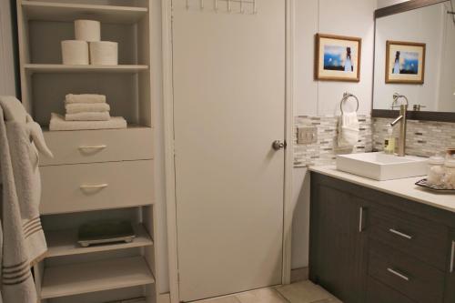 a bathroom with a sink and a mirror at Paradise View Getaway-Dacha in Hartwell
