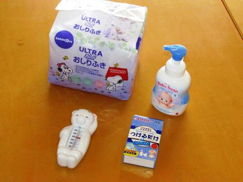 a table with a bottle of milk and a baby bottle at Jakomaru Park Tsuda in Sanuki