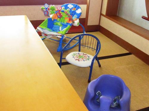 a table and two chairs sitting next to a table at Jakomaru Park Tsuda in Sanuki