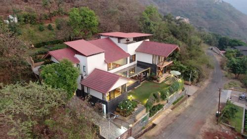 an aerial view of a house with red roofs at Soul Tree Villa 50 Super Luxury Villa with heated plunge pool and jacuzzi in Lavasa