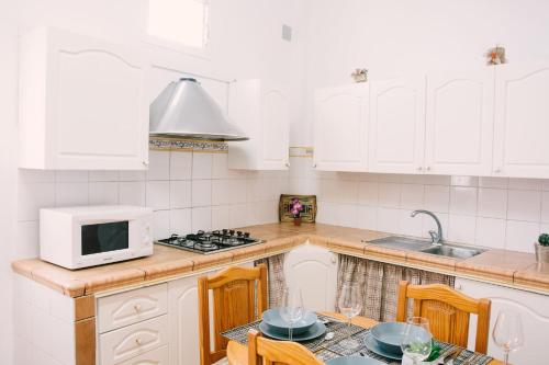 A kitchen or kitchenette at Casa Beta Ven A Disfrutarla