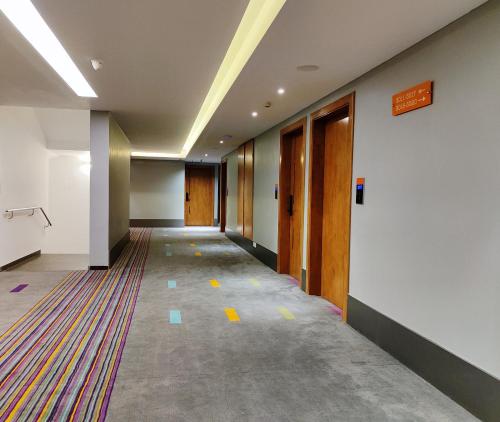 an empty hallway of an office building with a hallway at Zone Connect by The Park Coimbatore in Coimbatore