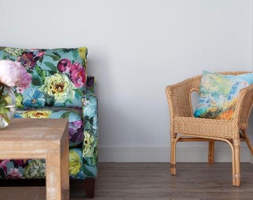 a living room with a couch and a chair at The Crows Nest in Port Isaac