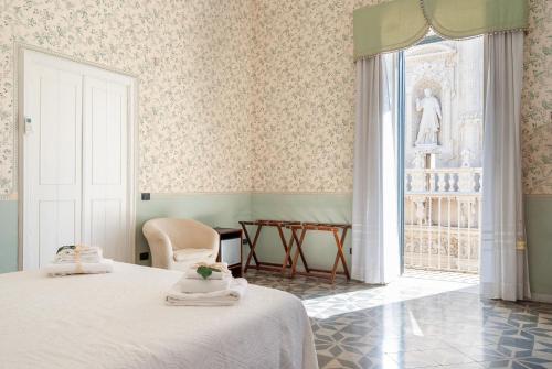 Posteľ alebo postele v izbe v ubytovaní B&B Risveglio col Rosone