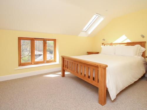 Voodi või voodid majutusasutuse The Stables, Burton Bradstock toas