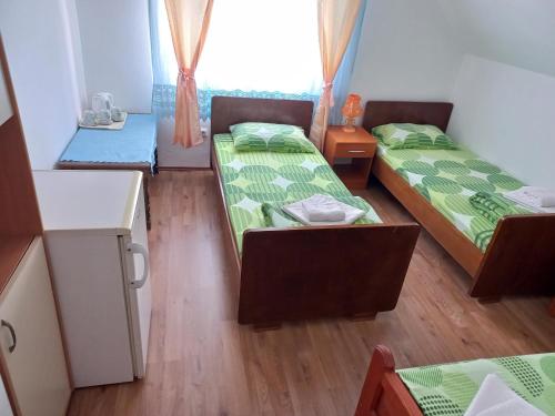 Cama o camas de una habitación en Apartmani Sobe Sljivancanin