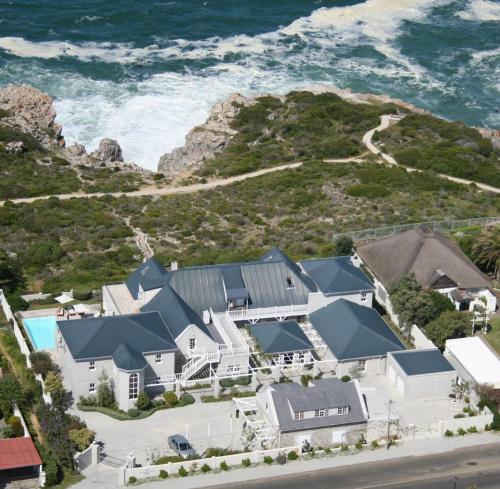 an aerial view of a house by the ocean at 11 WESTCLIFF RENTALS in Hermanus