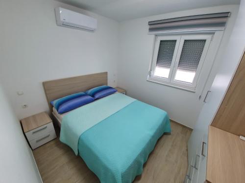Posteľ alebo postele v izbe v ubytovaní Apartman Lea Makarska