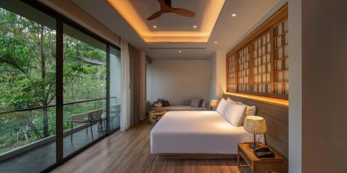 Katil atau katil-katil dalam bilik di Noku Phuket