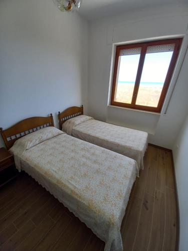 Postel nebo postele na pokoji v ubytování Appartamento fronte mare costa dei trabocchi