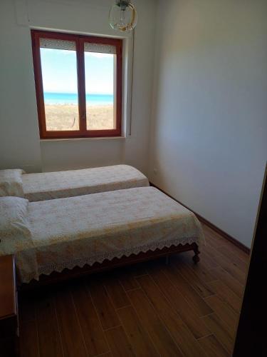 Postel nebo postele na pokoji v ubytování Appartamento fronte mare costa dei trabocchi