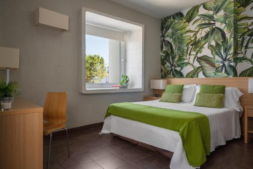 En eller flere senge i et værelse på Duparc Hotel