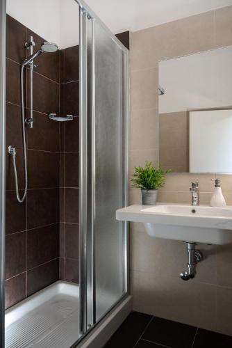 a bathroom with a shower and a sink at Club Hotel in Gabicce Mare