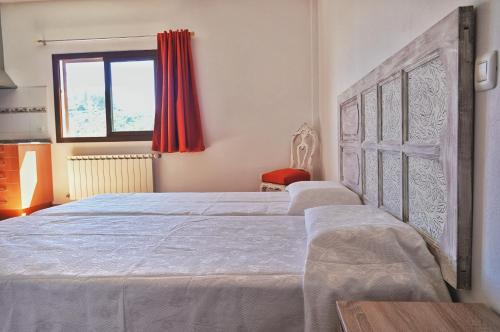 En eller flere senge i et værelse på Villas el Alto