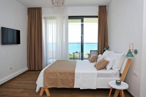 Posteľ alebo postele v izbe v ubytovaní Villa Seabatical