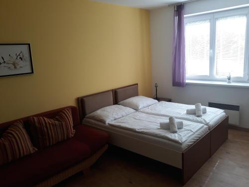 Katil atau katil-katil dalam bilik di Apartmán Richard