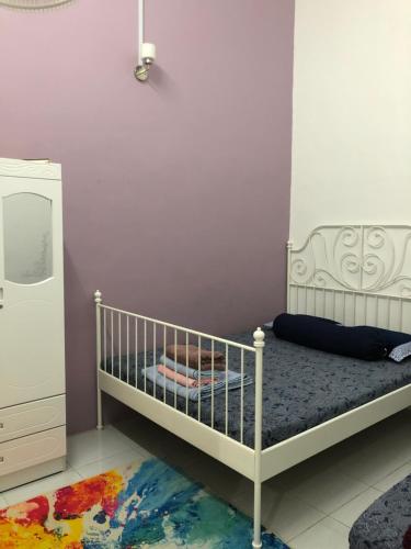 Ліжко або ліжка в номері Ina Homestay Jerantut