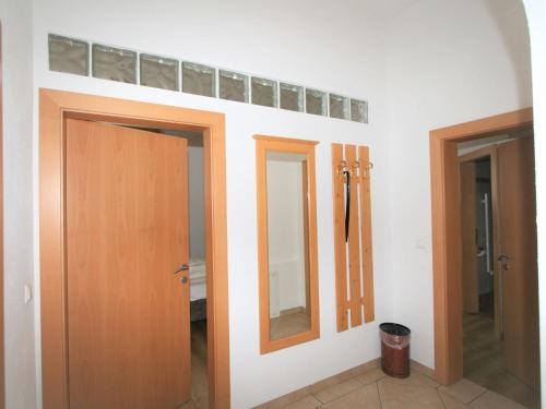 a room with two doors and a mirror at Apartment Lechners Wohnwelt-3 by Interhome in Stumm