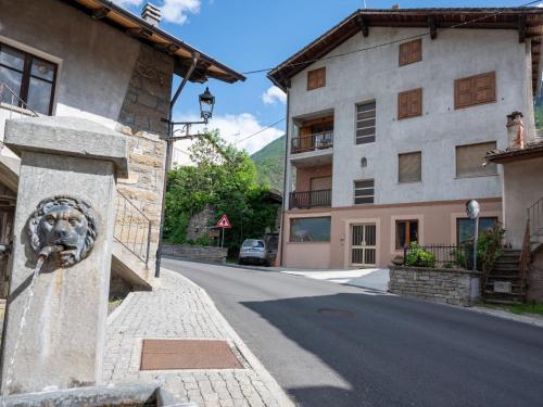 a stone lion head on the side of a building at Apartment La Maison d'Amelie by Interhome in Fenis