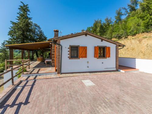 a small house on a brick driveway at Holiday Home Il Felciaio by Interhome in Sassa