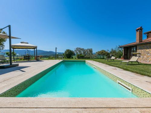a swimming pool in the backyard of a house at Holiday Home Metallo by Interhome in Colle Val D'Elsa