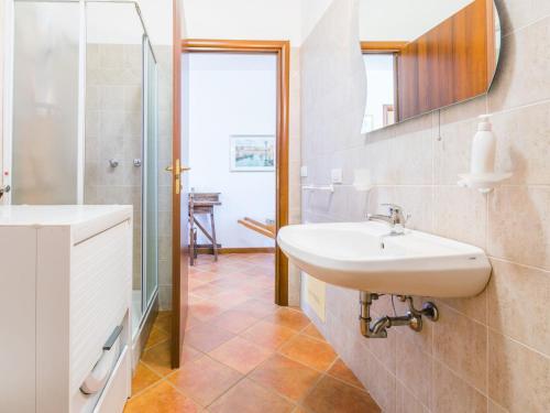 a bathroom with a sink and a mirror at Holiday Home Metallo by Interhome in Colle Val D'Elsa