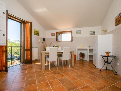 a kitchen and dining room with a table and chairs at Holiday Home Metallo by Interhome in Colle Val D'Elsa