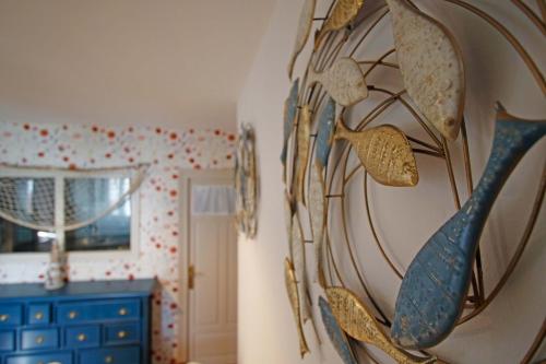 a room with a wall with many pairs of glasses at LA MAR SALADA in Lastres