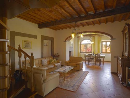 a living room with a couch and a table at Holiday Home La Casina by Interhome in Pieve a Maiano