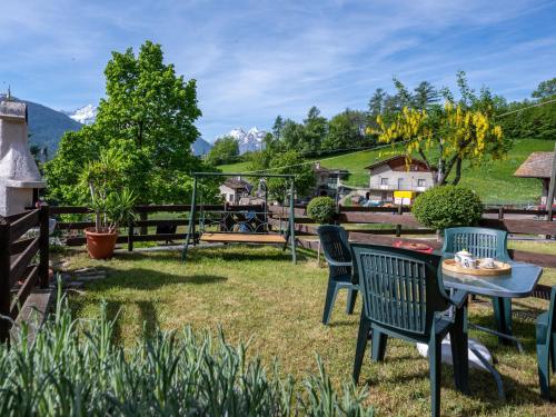a patio with chairs and a table in a yard at Holiday Home Maison Meynet by Interhome in Sarre