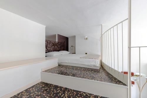 Una cama o camas en una habitación de Milan Retreats Duomo