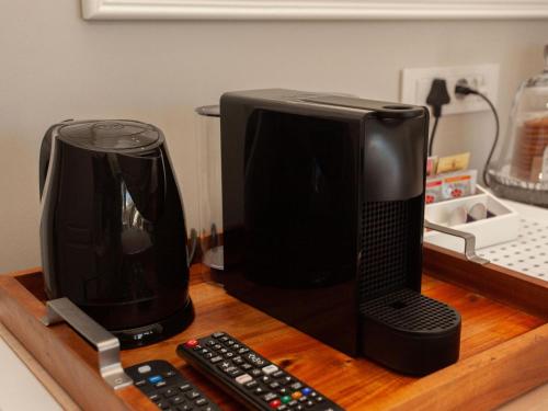 a computer monitor sitting on top of a wooden table at No 4 Boutique Beach House in Summerstrand