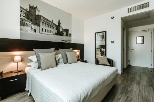 Ένα ή περισσότερα κρεβάτια σε δωμάτιο στο Hotel Carpi