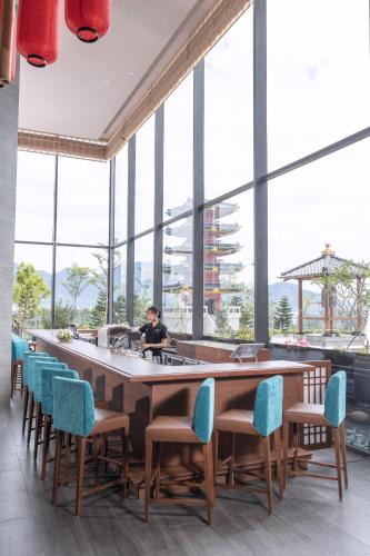 a large dining room with a large table and chairs at Da Nang - Mikazuki Japanese Resorts & Spa in Da Nang